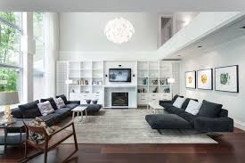 The cabinets are inspired by classic design, but given a more modern twist by painting it white and using less curves and carvings. 10 Wood Floors Design Ideas For Living Rooms Published In Pouted Online Magazine F Dark Wood Floors Living Room Dark Floor Living Room Living Room Scandinavian