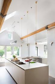 Light a sloping ceiling lighting from a different angle. Home Architec Ideas Cathedral Ceiling Kitchen Lighting Ideas