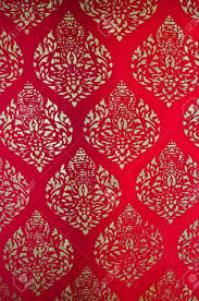 It's a pure primary red, like the silk lining of a jacket or the red of chinese lacquer. The Traditional Thai Style Art Golden Painting Pattern On Red Wall In Temple This Is Traditional And Generic Style In Thailand No Any Trademark Or Restrict Matter In This Photo Stock Photo