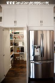Sitting atop four raised legs, the pieces also feature a durable granite countertop and a glossy modern white finish, accentuated with shiny bronze pulls. Dream Kitchen Hidden Walk In Pantry Cupboard Hidden Kitchen Pantry Layout Kitchen Pantry Design