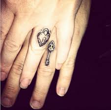 15 Tattoos That Are The Perfect Wedding Ring Alternative Lock And Key Finger Tattoos For Couples Ring Tattoo Designs Ring Tattoos