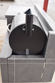traeger pellet smoker in a sunset