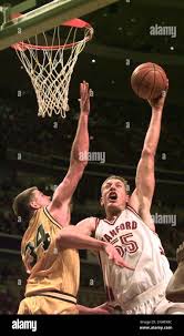 NCAA STAN 1/C/03MAR98/SP/MACOR Stanford's #55 Tim Young goes up for two  points in front of Western Michigan's #34 Aaron Toothman in the 2nd period.  Chronicle photo by Michael Macor. Also ran 3/28/98 (