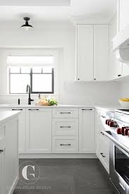Gray Tiles Cover The Floors Of This Beautiful Black And White Kitchen Fitted With White Shaker Cabine New Kitchen Cabinets Kitchen Remodel Small Kitchen Design