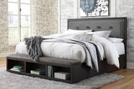 Alternatives to california king size mattresses. Hyndell Dark Brown California King Upholstered Panel Bed With Storage On Sale At American Furniture Of Slidell Serving Slidell La
