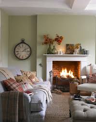 Living room ideas are designed to be an expression of their owner's personality and design sensibilities, and that's certainly the case with this regal design choice. Compact Country Living Room With Open Fire The Room Edit Country Style Living Room Cosy Living Room Country Living Room
