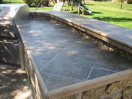The largest of the small pieces is a piece of solid surface material. Messenger S Landscape Lawn And Irrigation Outdoor Kitchen Countertops Kitchen Countertops Tile Countertops
