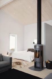 Wood stoves are easy to use and efficient. Scandinavian Retreat Leisure House In Are Home Bedroom Stove Decor Modern Tiny House