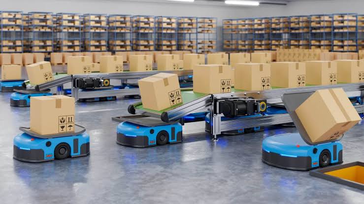 Automated Guided Vehicles (AGVs) navigating a warehouse environment alongside conveyor systems., AI generated
