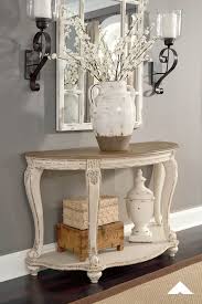 Realyn Sofa Table By Ashley Furniture Pastoral Charm Elevating The Art Of Traditional Cottage Styling Foyer Table Decor Entry Table Decor Sofa Table Decor