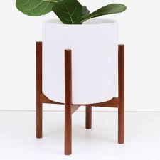 Bring the outside in your apartment with pots and planting essentials at urban outfitters. Peach Pebble 11 In White Ceramic Planter With Wood Stand 11 In Or 9 In Home Depot