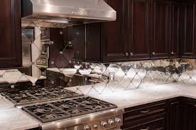 Over the years i've done quite a few tile project (floors, showers, backsplashes, fireplaces) and worked with numerous materials (marble, porcelain, ceramic), but none were as difficult to work with as mirrored subway tile. Antique Mirror Subway Tile Backsplash Contemporary Kitchen Orange County By Jockimo Inc Houzz