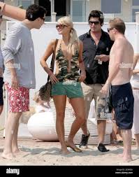 Paris Hilton has a few friends round for a low-key get together on  Saturday afternoon. Included guests were her publicist Elliott Mintz and Brandon  Davis. Paris also spent time with her new