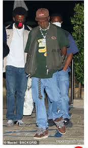 Check out our travis scott shirt selection for the very best in unique or custom, handmade pieces from our clothing shops. Travis Scott Rocks Olive Green Vest And Light Wash Baggy Jeans While Hanging Out With Friends In Nobu Malibu Report Minds