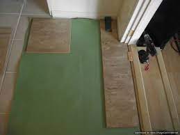 You can also just install pergo over the floor, even if it's a bit uneven, but you risk cracking or separating the tiles eventually. Installing Laminate Tile Over Ceramic Tile Diy Laminate Floors Wonderhowto