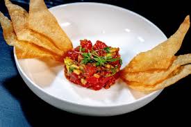 Return the pan you used for your tacos to a high heat and cook the fish mixture for around 4 minutes, or until the fish is cooked through and lightly golden. Ehytlluqixdi1m