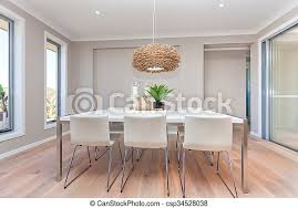 Decorating a room represents an individual choice, but before beginning to plan to design your dream dining room, a couple of rules must be followed. Modern Dining Room Design With Table Set Up And Natural Decorations Luxury Dining Room And A Light Color Wooden Floor And Canstock