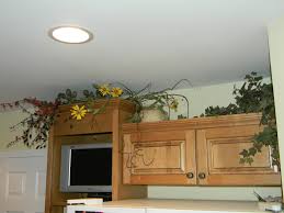Some people will put plants above their cabinets. Decorating Above Kitchen Cabinets Before And After Pictures And Tips Joyful Daisy
