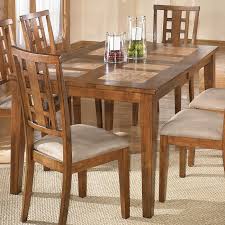 Extending solid heavy tiled patterned top dining room table with 6 wood chairs in good condition nice show piece in any home the measurements will follow please ring or text me for more details please take a look at my other items. Tucker Tile Top Dining Table Signature Design By Ashley Furniture Furniturepick
