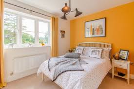 As the brightest color in the room, orange takes the focus while warm gray walls, a white iron bed frame, and an heirloom quilt create a harmonious background. 75 Beautiful Orange Bedroom Ideas Designs May 2021 Houzz Uk