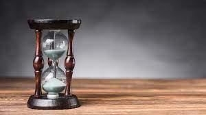 Download Transparent Sand Hourglass On Wooden Desk Against Gray Background For Free Hourglass Gray Background Sand Hourglass