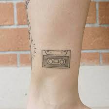 It is probably a nod to her band boomkat. Tattoo Tagged With Music Small Cassette Betapokes Tiny Ankle Hand Poked Ifttt Little Inked App Com