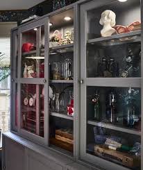 A Gray Side Cabinet With Glass Fronted Sliding Doors Living Room Style Ikea Living Room Fashion Room