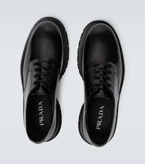 The upper part of the shoe pays respect to the traditional derby shape, which dates back to the 1800s, also making use of classic buffed leather. Leather Derby Shoes Prada Mytheresa