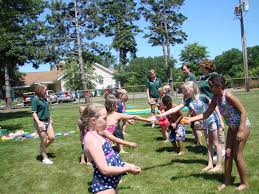The goal of this relay race game is to pass the balloon down the teams' rows by gripping the balloon between the knees. Games The Resort Guide