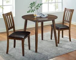 These dark brown dining chairs are not just ideal for dinner tables but can be set up anywhere without hampering their unique look. Blackwood 3 Pc Walnut Brown Dining Table Set By Furniture Of America