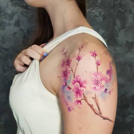 Tattoo of a cherry blossom done on the shoulder,