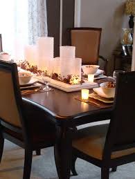 Nicely decorated tables would provide a warm and beautiful platform to serve food and garner you all the appreciation. Red Flower White Candle Holder Tray Top Dark Brown Enthralling Dining Table Centerpieces Room Home Decor Ideas Editorial Ink Us Freshsdg