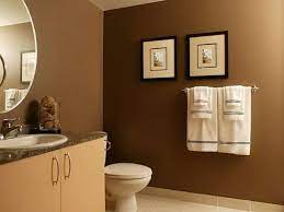 A natural, neutral color, chocolate brown represents wholesomeness, healing, grounding, stability and honesty. Small Bathroom Paint Colors Chocolate Brown Walls Decorated With A Round Mirror And Simple Bathroom Renovation Romantic Bathroom Decor Bathroom Wall Colors