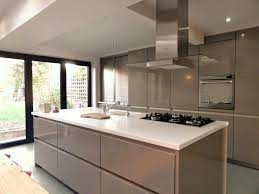 Modern kitchens go for a minimalist style. Manufacturer Schuller Germany Range C Collection Door Gala Truffle Brown High Gloss Worktop Corian A Taupe Kitchen Gloss Kitchen Cabinets Kitchen Style