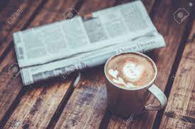 Your coffee table newspaper stock images are ready. A Newspaper And A Cup Of Coffee On A Wooden Table Stock Photo Picture And Royalty Free Image Image 65196776