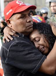 Tearful Chavez supporters cover hearse in flowers