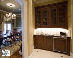 A wet bar is more than just running water and drinks, it makes a bar look more complete. Wet Bar Between Kitchen And Dining Room Wet Bar Traditional Dining Room House Design