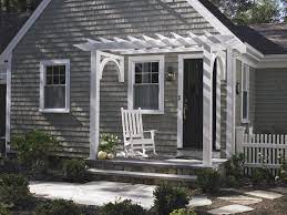 A Traditional Entry Pergola Frames This Front Door And Small Porch Front Porch Pergola Porch Design Door Pergola