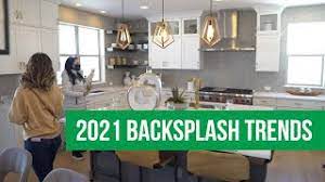 Dramatic backsplash slabs with bold contemporary veinings or movement, rather than the last decade's subway tile is part of the seamless kitchen trends of 2021! 2021 Backsplash Trends Youtube