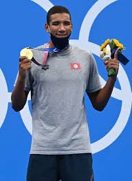 Growing up hafnaoui's idol was tunisian distance swimming legend oussama mellouli , who won the 1500m at beijing . Gx5tke7n9dtoqm