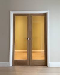 White glazed internal doors offer a modern touch to the traditional oak doors with glass. Internal Glazed Double Doors London Door Company