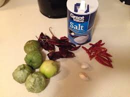 While you are waiting for the water, heat a flat pan to very high heat, lay a sheet of tin foil in the bottom of the pan and place tomatoes, garlic clove and chiles on top. Chile Rojo Receta