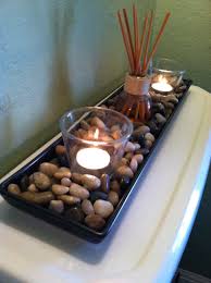 There is a multitude of sizes, funky shapes, and intriguing scents, all of which will enhance the style and atmosphere of your bathroom. Cheap Rocks From Ikea A Couple Candles And A Scented Oil Reed Diffuser Cheap And Easy And Apartment Bedroom Decor Bathroom Decor Apartment Apartment Decor