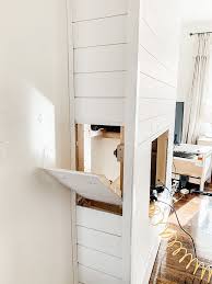 Plenty of built in storage was included on this project. Diy Shiplap Electric Fireplace Mantel Micheala Diane Designs