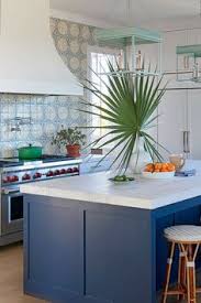 One end of the island is prep space with a sink and countertops. 450 Coastal Kitchens Ideas Coastal Kitchen Kitchen Design Beach House Kitchens