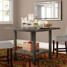 The rokane counter height table set keeps things cozy with its light brown textured fabric and cushioned seats. Three Posts Stolle Counter Height Trestle Dining Table Reviews Wayfair
