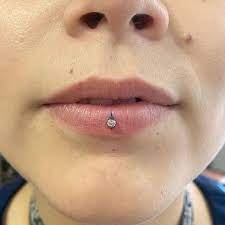 Ashley Piercing 50 Ideas And Complete Guide Rightpiercing Ashley Piercing Facial Piercings Labret Piercing Ring