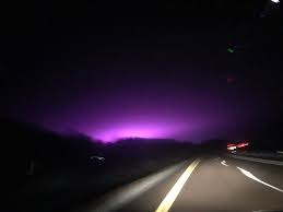 Theories were posed about what the purple could be from low hanging clouds to an alien invasion. What Is This Violet Colored Spread In The Sky Travel Stack Exchange