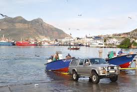He is showing her a whole red. Hout Bay Fishmeal Plant Closes But Gap To Be Filled Fishing Industry News Sa