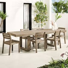 The bench features the same design as the dining table, creating a seamless look throughout the entire set. Portside Outdoor Expandable Dining Table Solid Wood Chairs Set